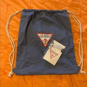 Guess bag and earbud headphones